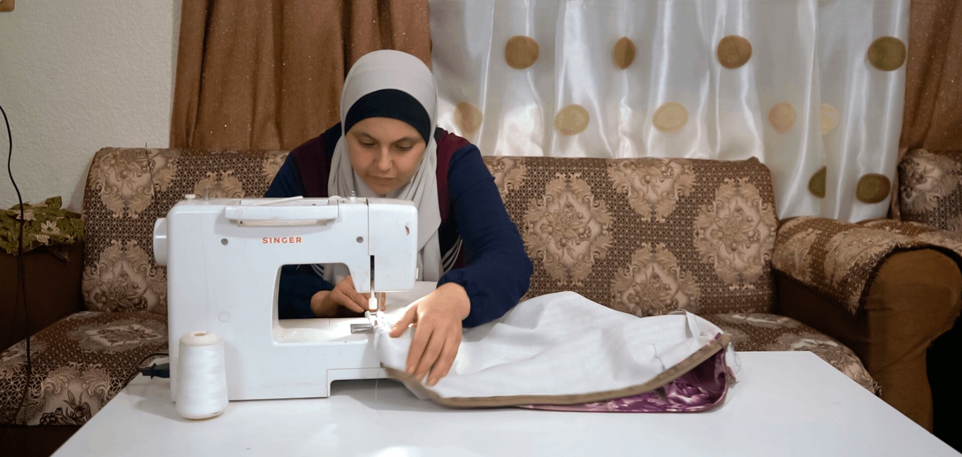 cta_jordan_woman-works-at-her-sewing-machine