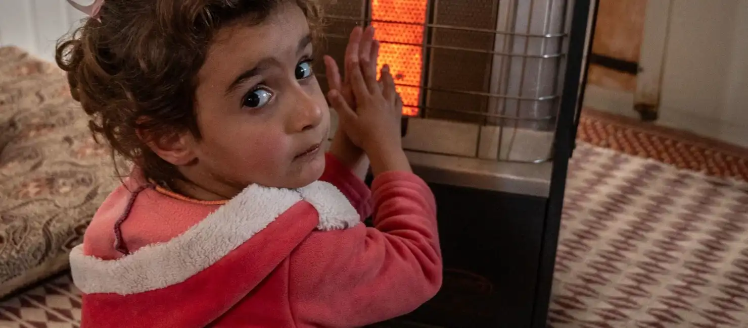 Jordan Syrian Refugee Girl Beside Gas Heater Zaatari