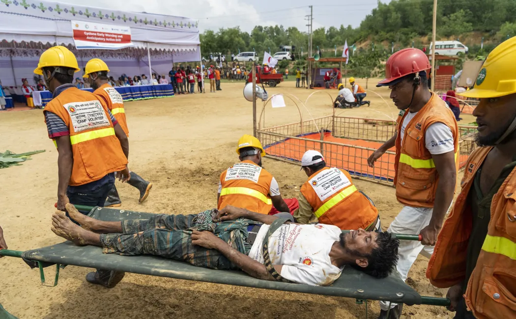 Bangladesh. Rohingya refugees practice a cyclone action drill