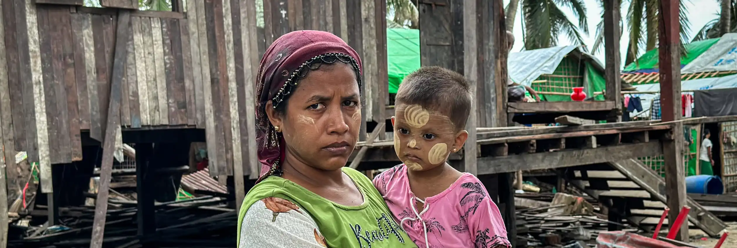 banner_myanmar_woman-and-child-damaged-home-after-cyclone-mocha