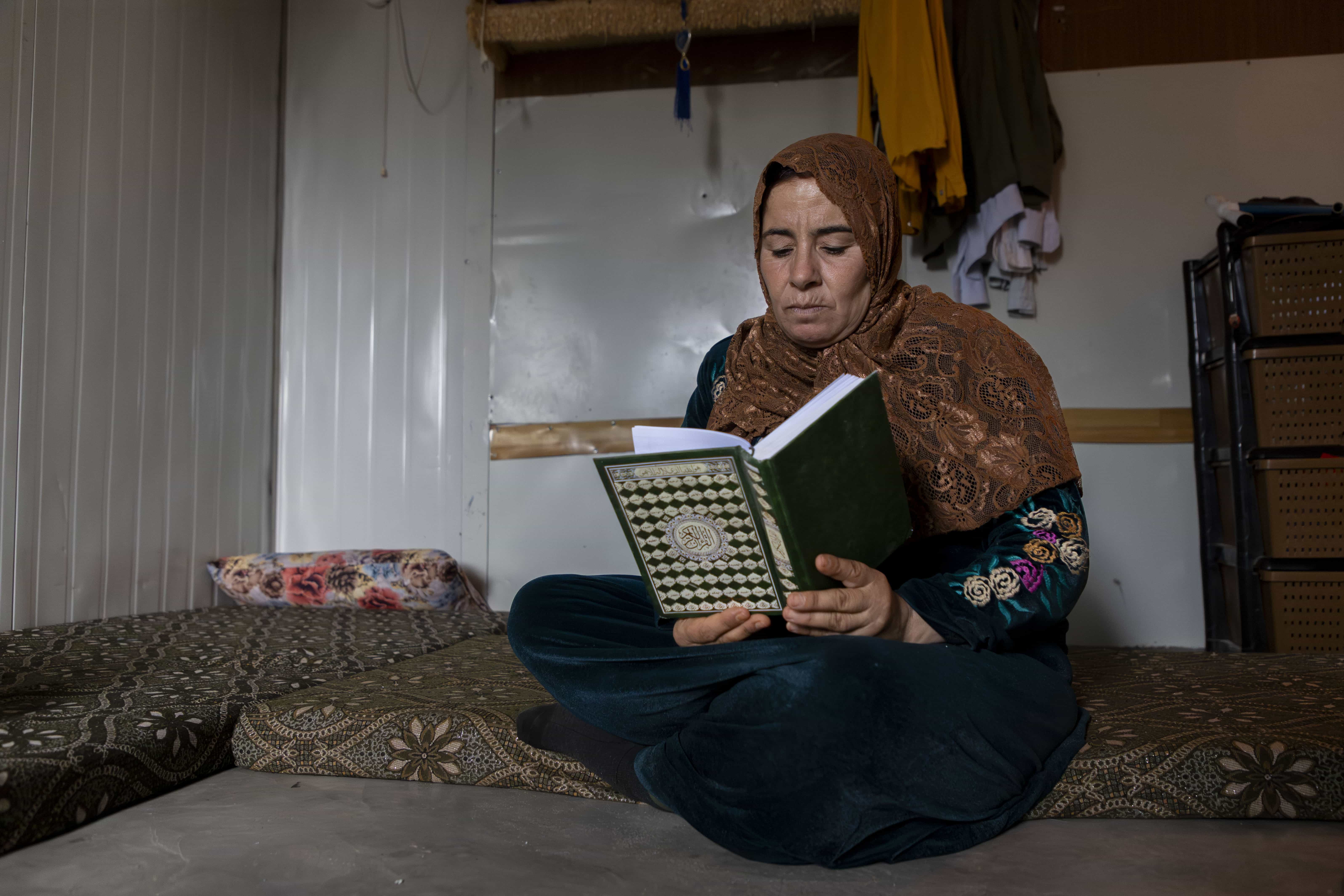 Jordan_Syrian-refugee-Awatef-reads-the-Quran