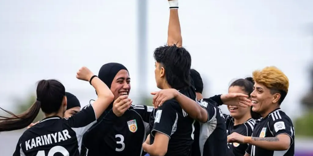 Afghanistan_Afghan Women United football team celebrate scoring a goal
