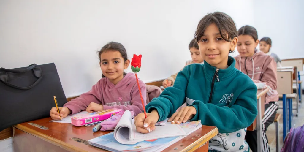 Tojan and Jana, two Syrian refugee students in Erbil, attend UNHCR-supported catch-up classes alongside other refugee and local children.